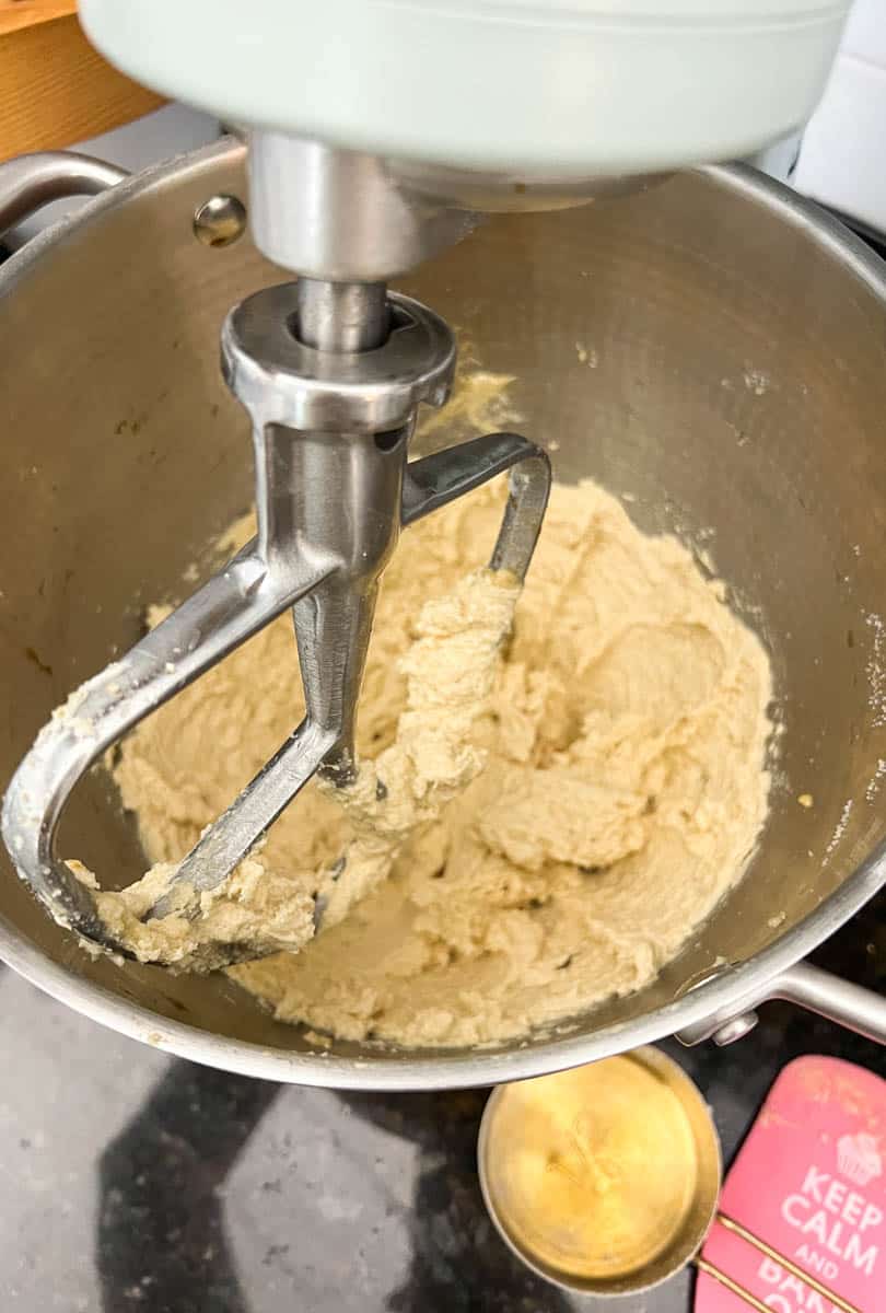 Creaming together butter and sugars for double chocolate chip cookies.