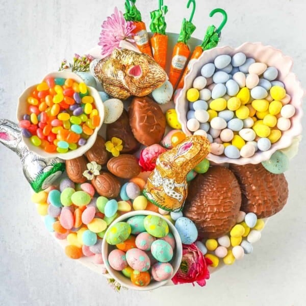 How to make a beautiful Easter Candy Charcuterie Board featuring colorful and sweet Easter candies and decadent chocolates. I will share tips for making a gorgeous Easter dessert board.