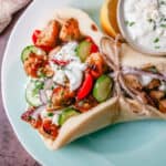 Greek Chicken Gyros with Tzatziki Sauce. How to make the best chicken gyros at home.