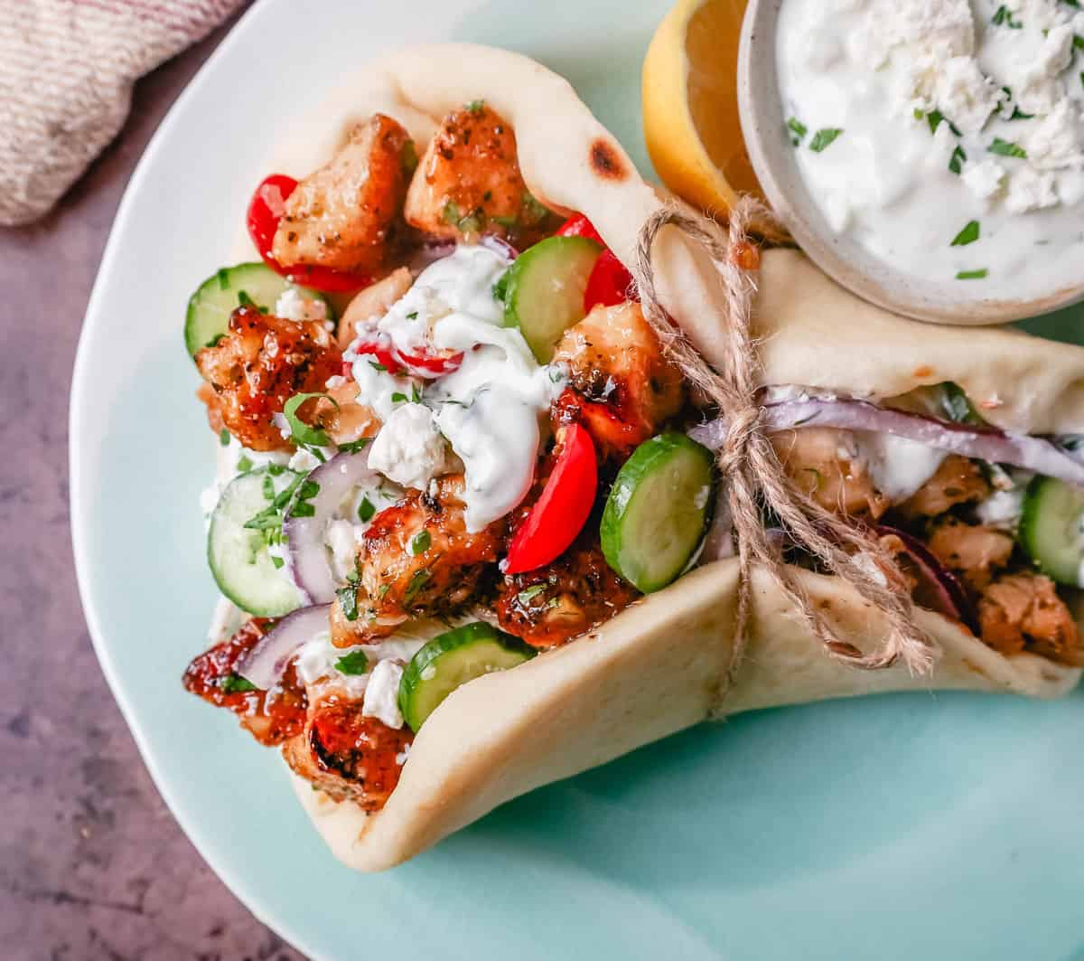 Greek Chicken Gyros with Tzatziki Sauce. How to make the best chicken gyros at home.