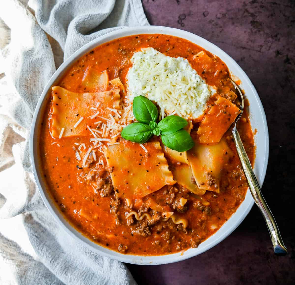Lasagna Soup. A hearty beef lasagna soup with fresh ricotta cheese, mozzarella, and parmesan cheeses and fresh herbs. An Italian classic made into a comforting soup!