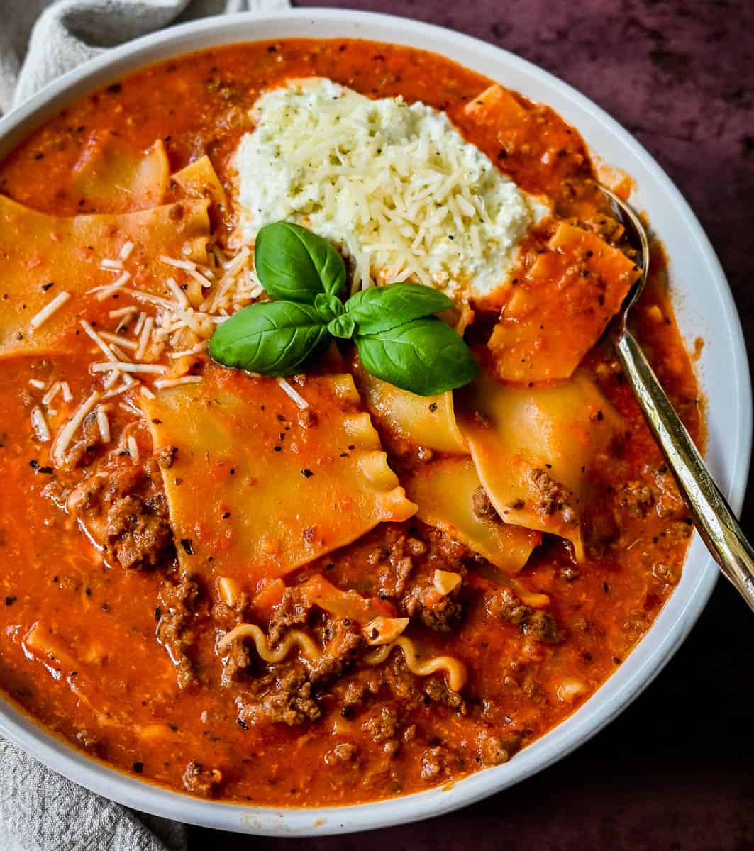 Lasagna Soup. A hearty beef lasagna soup with fresh ricotta cheese, mozzarella, and parmesan cheeses and fresh herbs. An Italian classic made into a comforting soup!