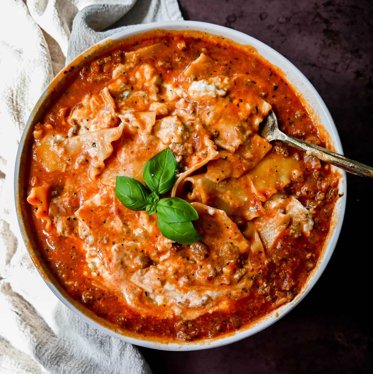 Lasagna Soup. A hearty beef lasagna soup with fresh ricotta cheese, mozzarella, and parmesan cheeses and fresh herbs. An Italian classic made into a comforting soup!