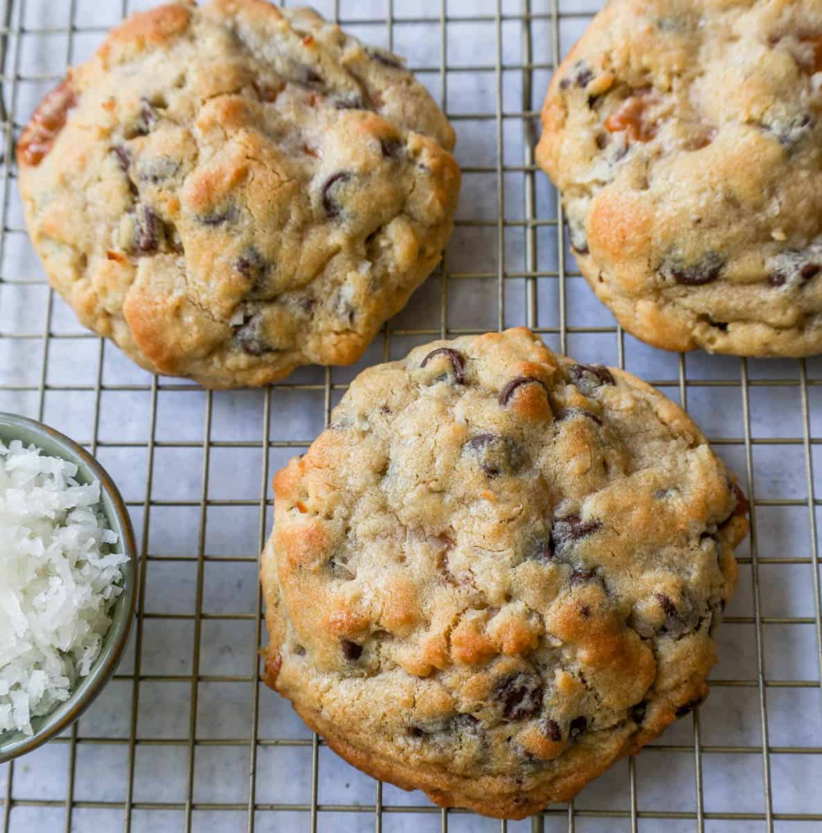 Soft, chewy thick Levain Bakery Caramel Coconut Cookies made with rich caramel, sweet coconut flakes, and semisweet chocolate chips. This seasonal Levain Bakery cookie recipe is the perfect coconut caramel cookie.