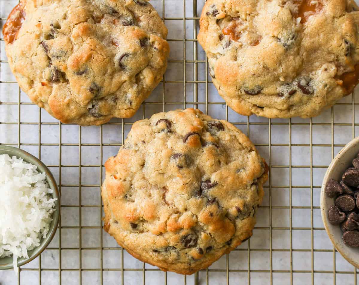 Soft, chewy thick Levain Bakery Caramel Coconut Cookies made with rich caramel, sweet coconut flakes, and semisweet chocolate chips. This seasonal Levain Bakery cookie recipe is the perfect coconut caramel cookie.