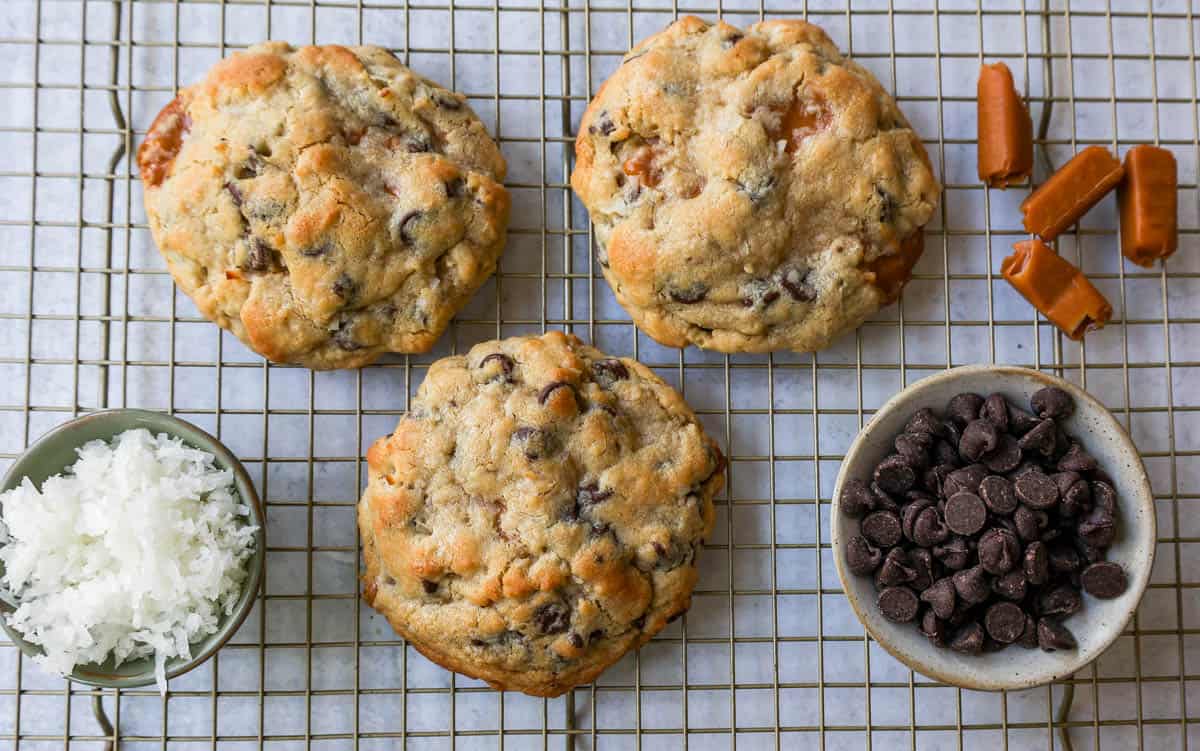 Soft, chewy thick Levain Bakery Caramel Coconut Cookies made with rich caramel, sweet coconut flakes, and semisweet chocolate chips. This seasonal Levain Bakery cookie recipe is the perfect coconut caramel cookie.