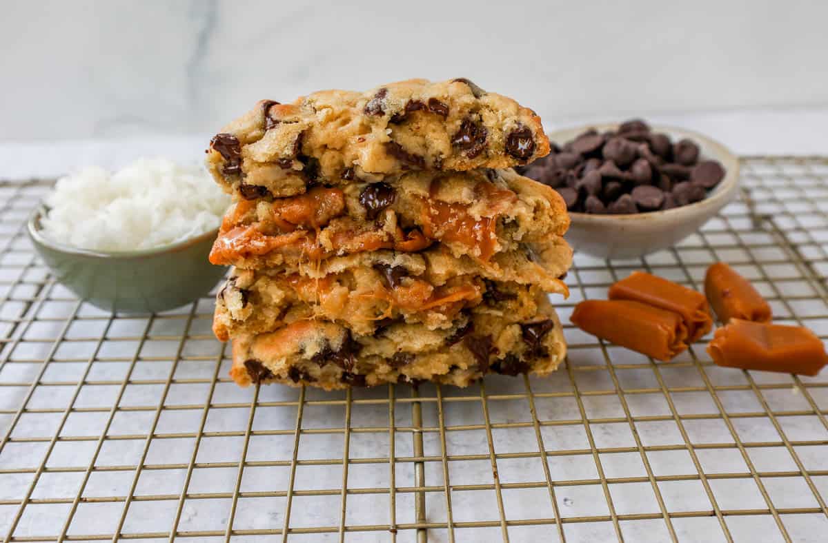 Soft, chewy thick Levain Bakery Caramel Coconut Cookies made with rich caramel, sweet coconut flakes, and semisweet chocolate chips. This seasonal Levain Bakery cookie recipe is the perfect coconut caramel cookie.