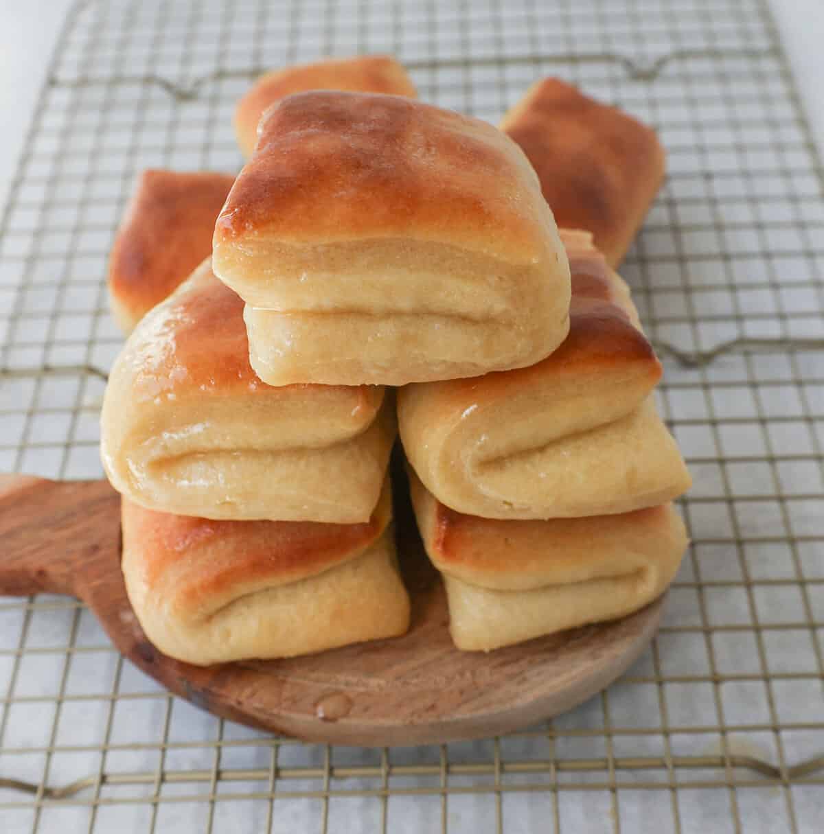 The Famous Parker House Rolls are light, fluffy, and buttery with a secret ingredient that make them tender and melt in your mouth. This the best parker house roll recipe!