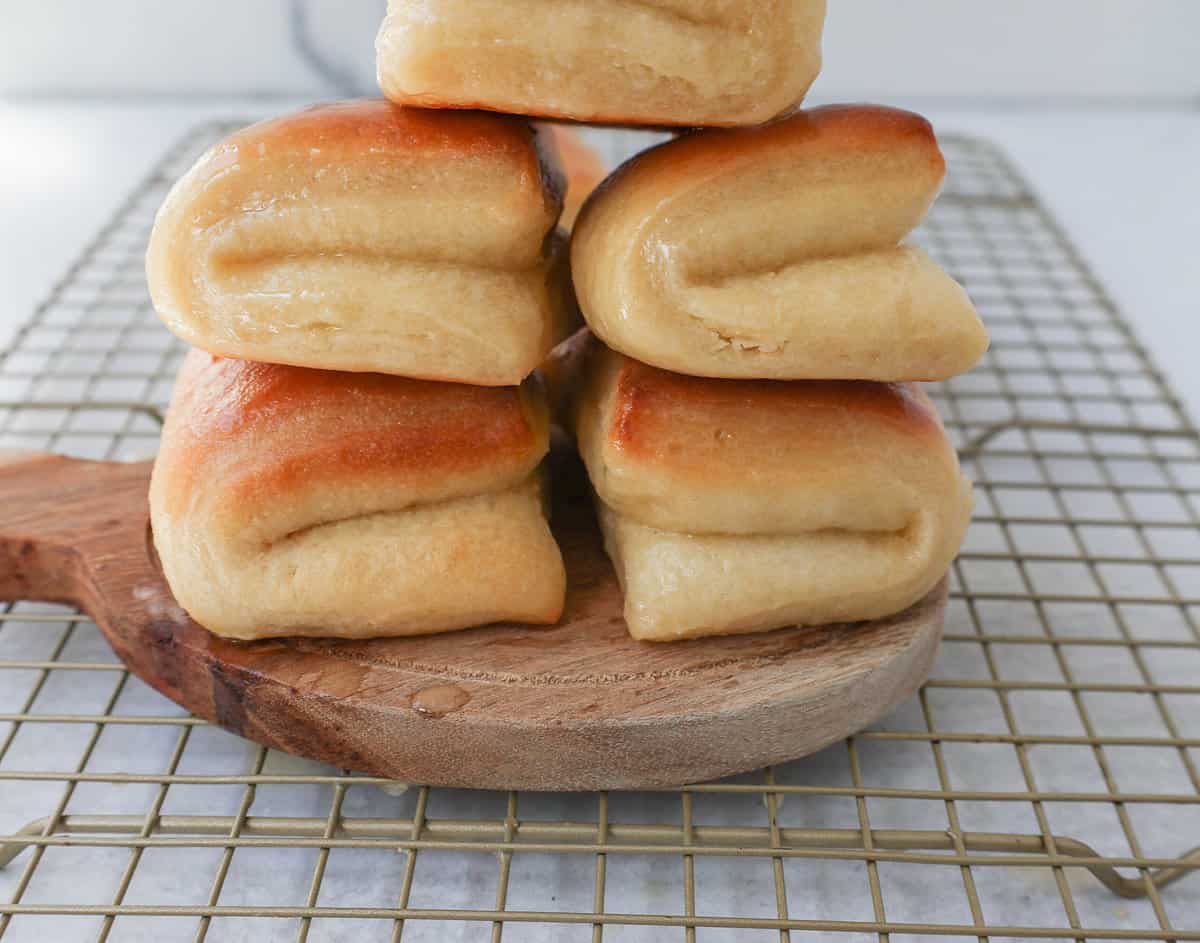 The Famous Parker House Rolls are light, fluffy, and buttery with a secret ingredient that make them tender and melt in your mouth. This the best parker house roll recipe!