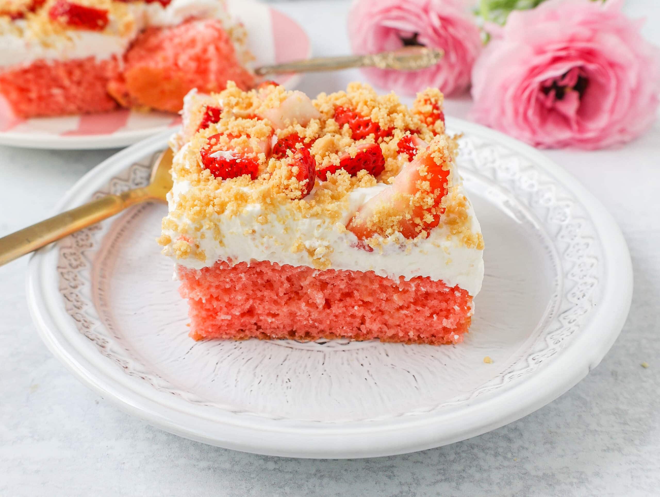 This Strawberry Cream Crunch Cake is a strawberry cake soaked with sweetened condensed milk after baking and topped with fresh sweet whipped cream, fresh strawberries, and crushed golden Oreos for crunch. This strawberry poke cake has it all!