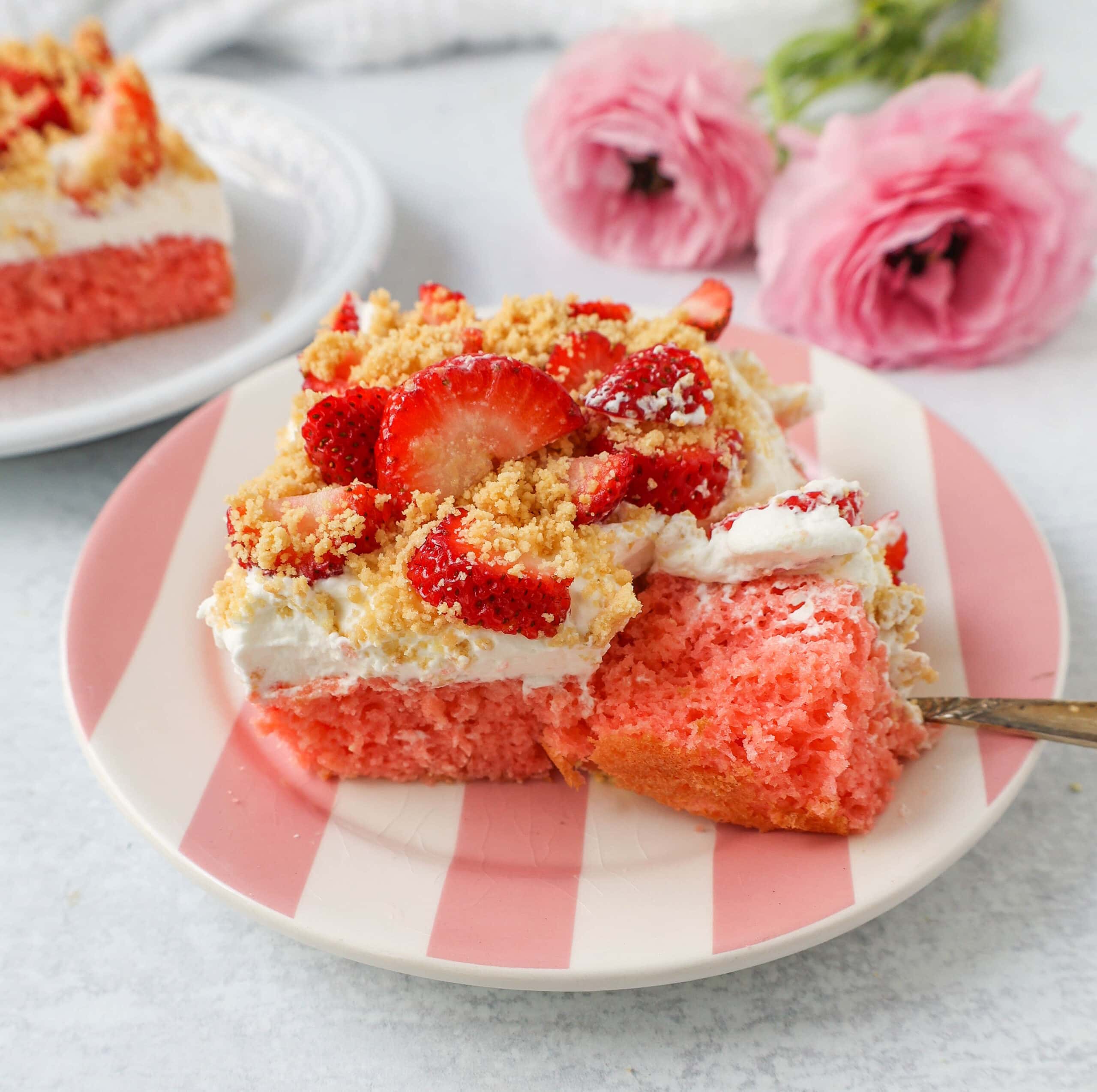 This Strawberry Cream Crunch Cake is a strawberry cake soaked with sweetened condensed milk after baking and topped with fresh sweet whipped cream, fresh strawberries, and crushed golden Oreos for crunch. This strawberry poke cake has it all!