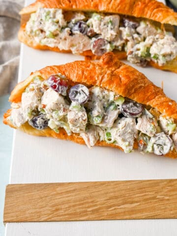 Creamy Homemade Chicken Salad made with tender chicken, crunchy celery, green onion, sweet grapes, and crunchy almonds in a mayonnaise dressing. This is a classic chicken salad recipe that everyone loves and is perfect for a quick lunch or potluck.