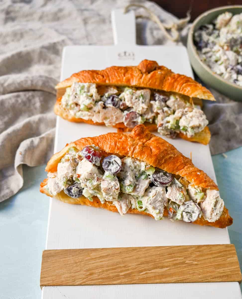 Creamy Homemade Chicken Salad made with tender chicken, crunchy celery, green onion, sweet grapes, and crunchy almonds in a mayonnaise dressing. This is a classic chicken salad recipe that everyone loves and is perfect for a quick lunch or potluck.