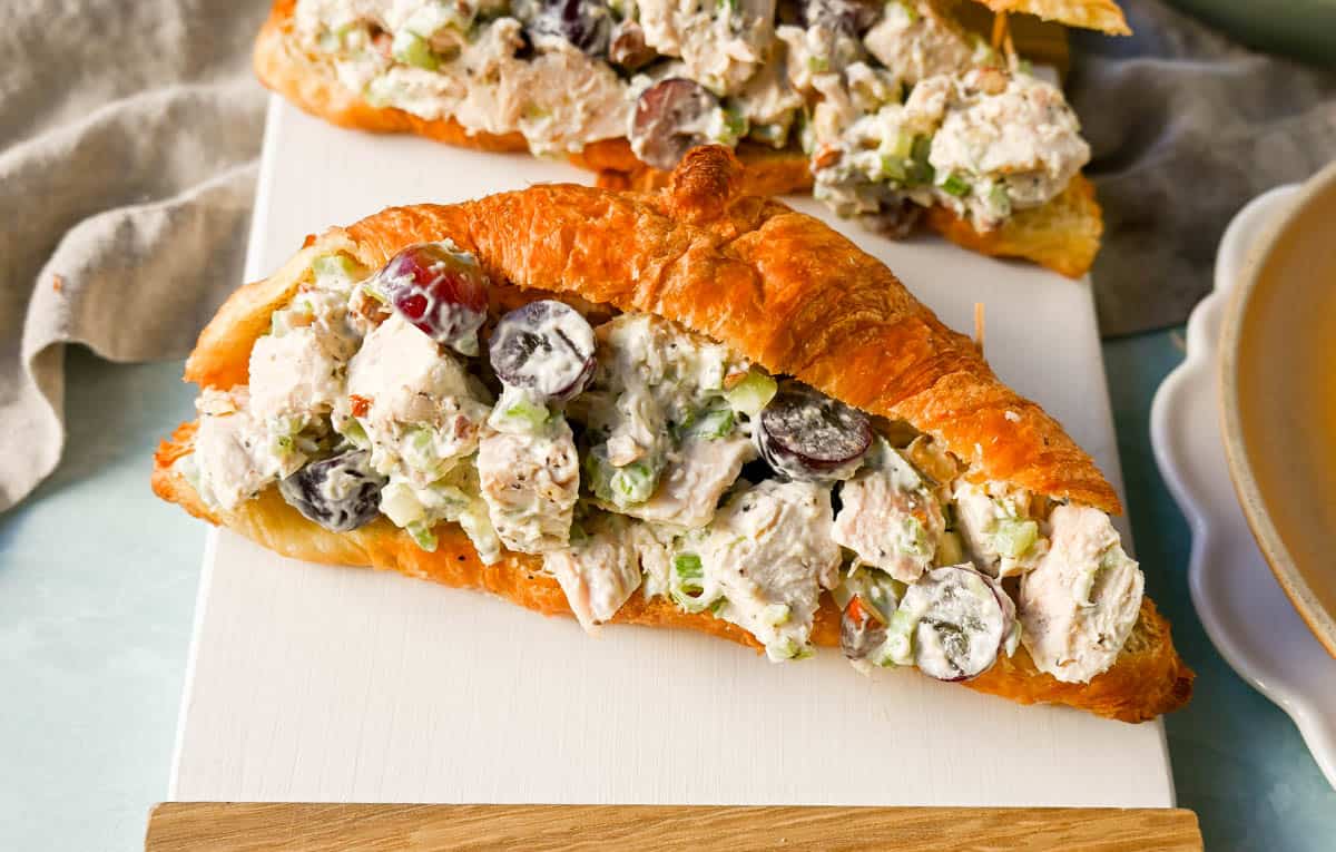 Creamy Homemade Chicken Salad made with tender chicken, crunchy celery, green onion, sweet grapes, and crunchy almonds in a mayonnaise dressing. This is a classic chicken salad recipe that everyone loves and is perfect for a quick lunch or potluck.