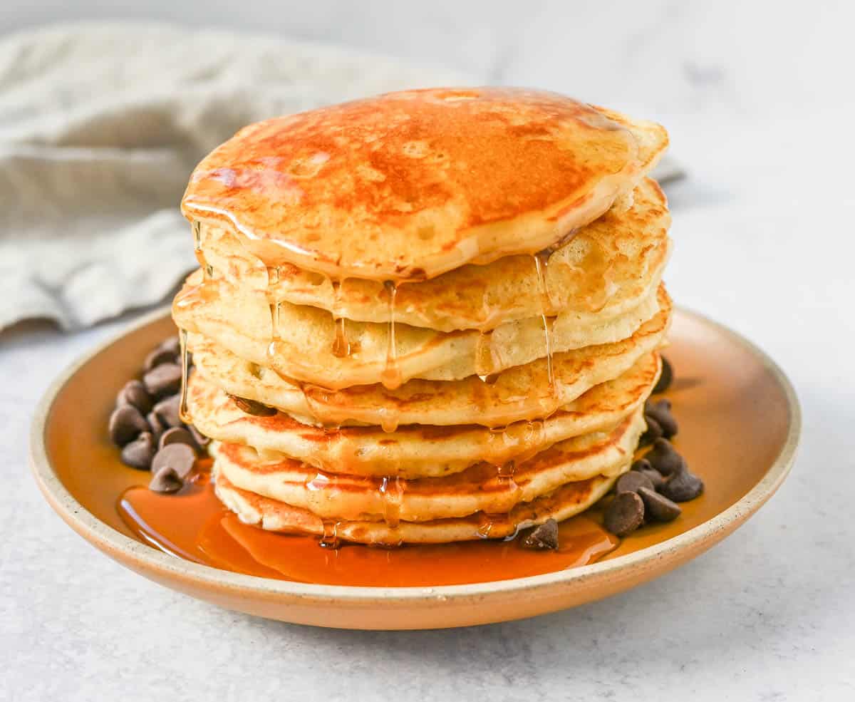The best chocolate chip pancakes! Homemade light, fluffy buttermilk chocolate chip pancakes with sweet milk or semi-sweet chocolate chips. These easy chocolate chip pancakes make the most decadent breakfast!