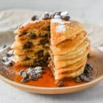 The best chocolate chip pancakes! Homemade light, fluffy buttermilk chocolate chip pancakes with sweet milk or semi-sweet chocolate chips. These easy chocolate chip pancakes make the most decadent breakfast!