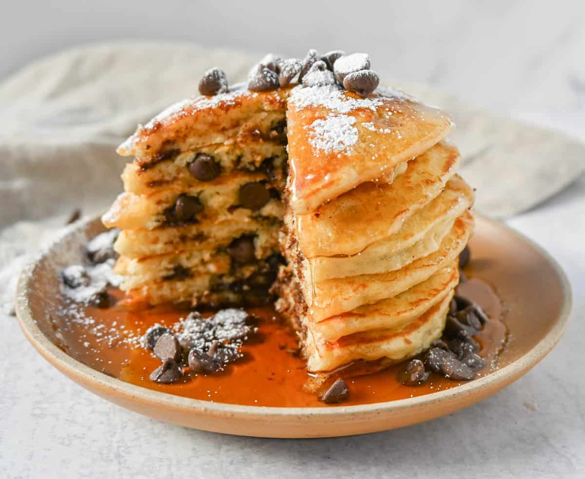 The best chocolate chip pancakes! Homemade light, fluffy buttermilk chocolate chip pancakes with sweet milk or semi-sweet chocolate chips. These easy chocolate chip pancakes make the most decadent breakfast!