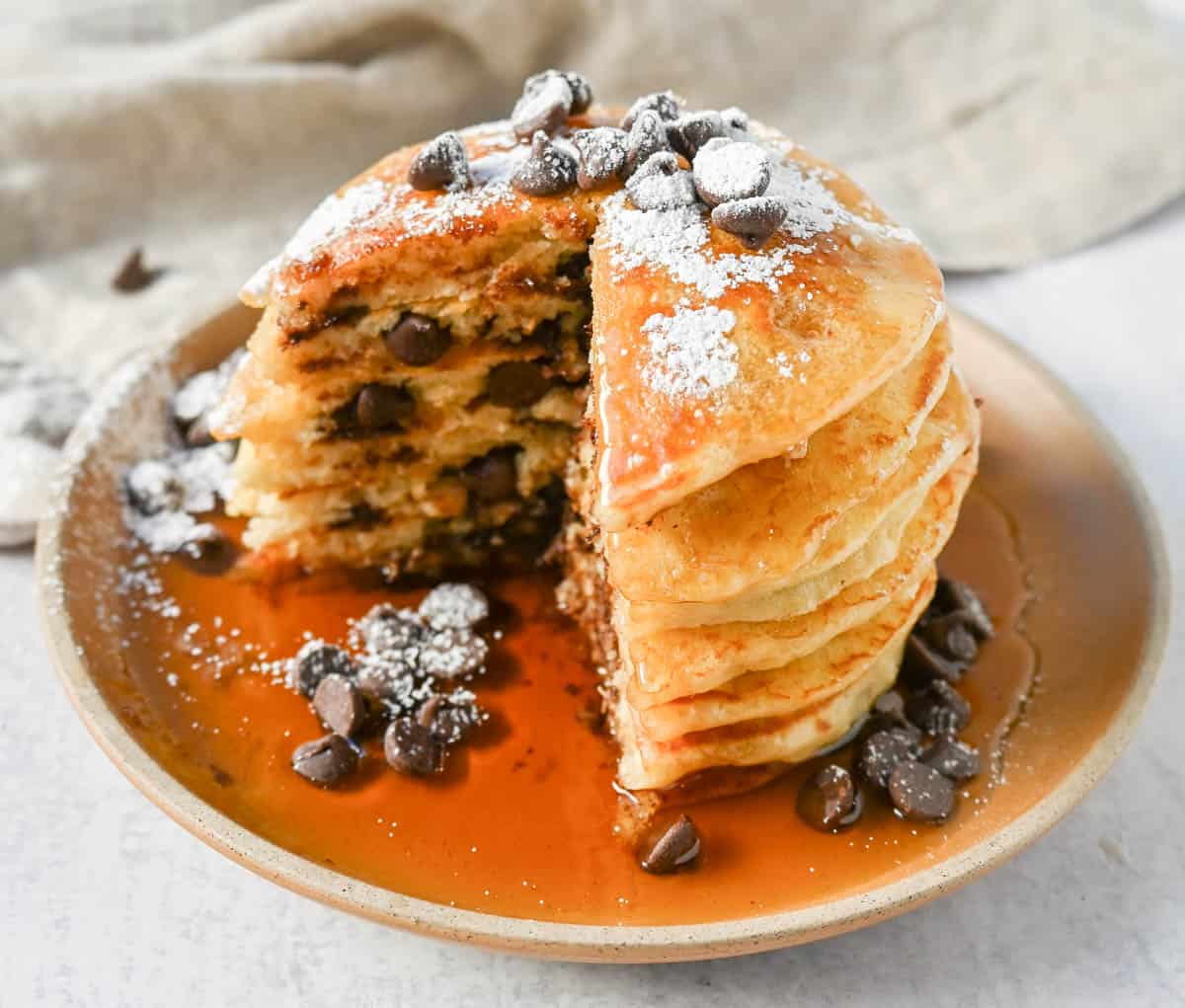 The best chocolate chip pancakes! Homemade light, fluffy buttermilk chocolate chip pancakes with sweet milk or semi-sweet chocolate chips. These easy chocolate chip pancakes make the most decadent breakfast!