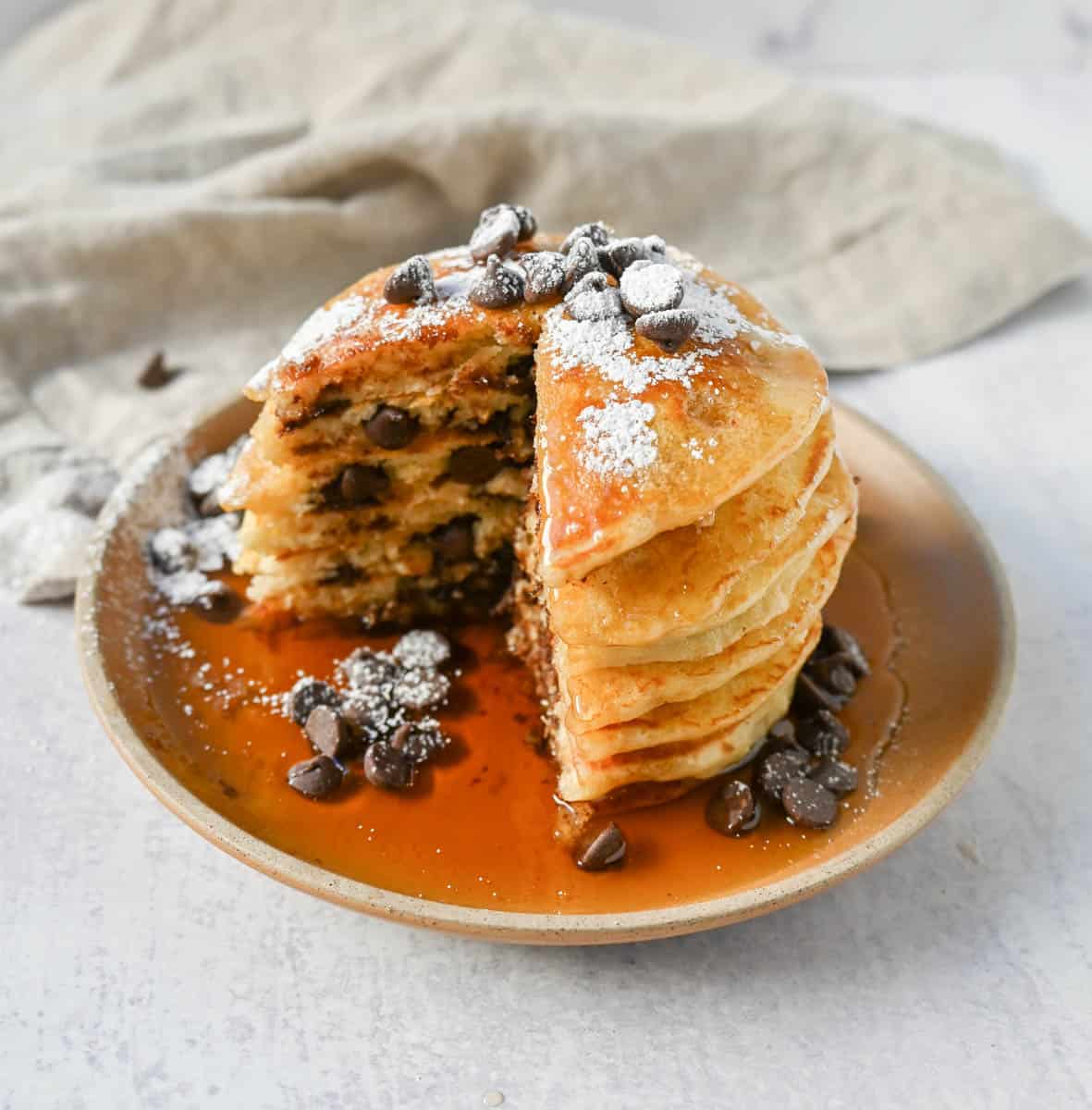 The best chocolate chip pancakes! Homemade light, fluffy buttermilk chocolate chip pancakes with sweet milk or semi-sweet chocolate chips. These easy chocolate chip pancakes make the most decadent breakfast!