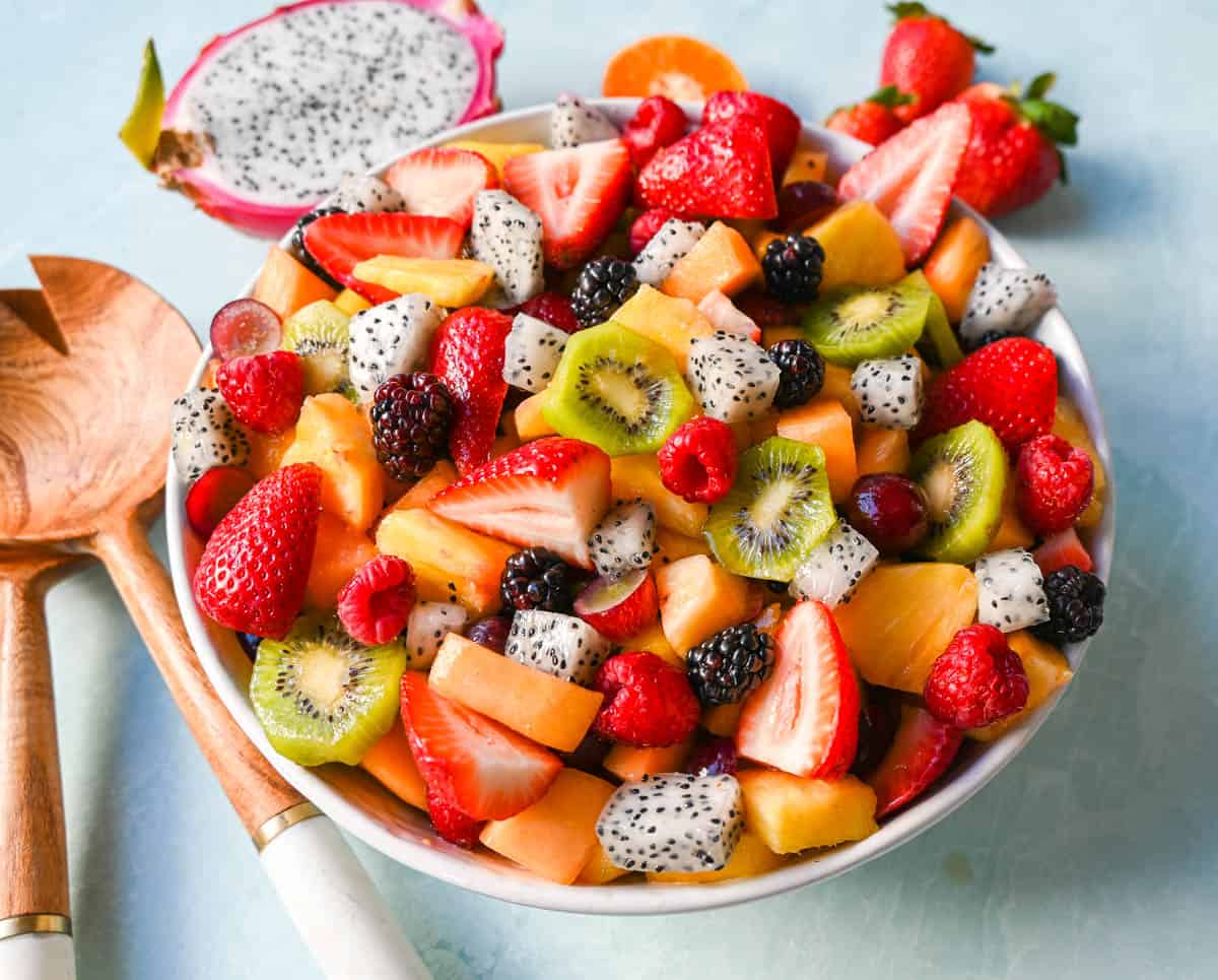 A bright and fresh fruit salad that is perfect for summertime! Made with vibrant and flavorful seasonal fruits and a sweet and simple honey lime dressing. The perfect fruit salad recipe!