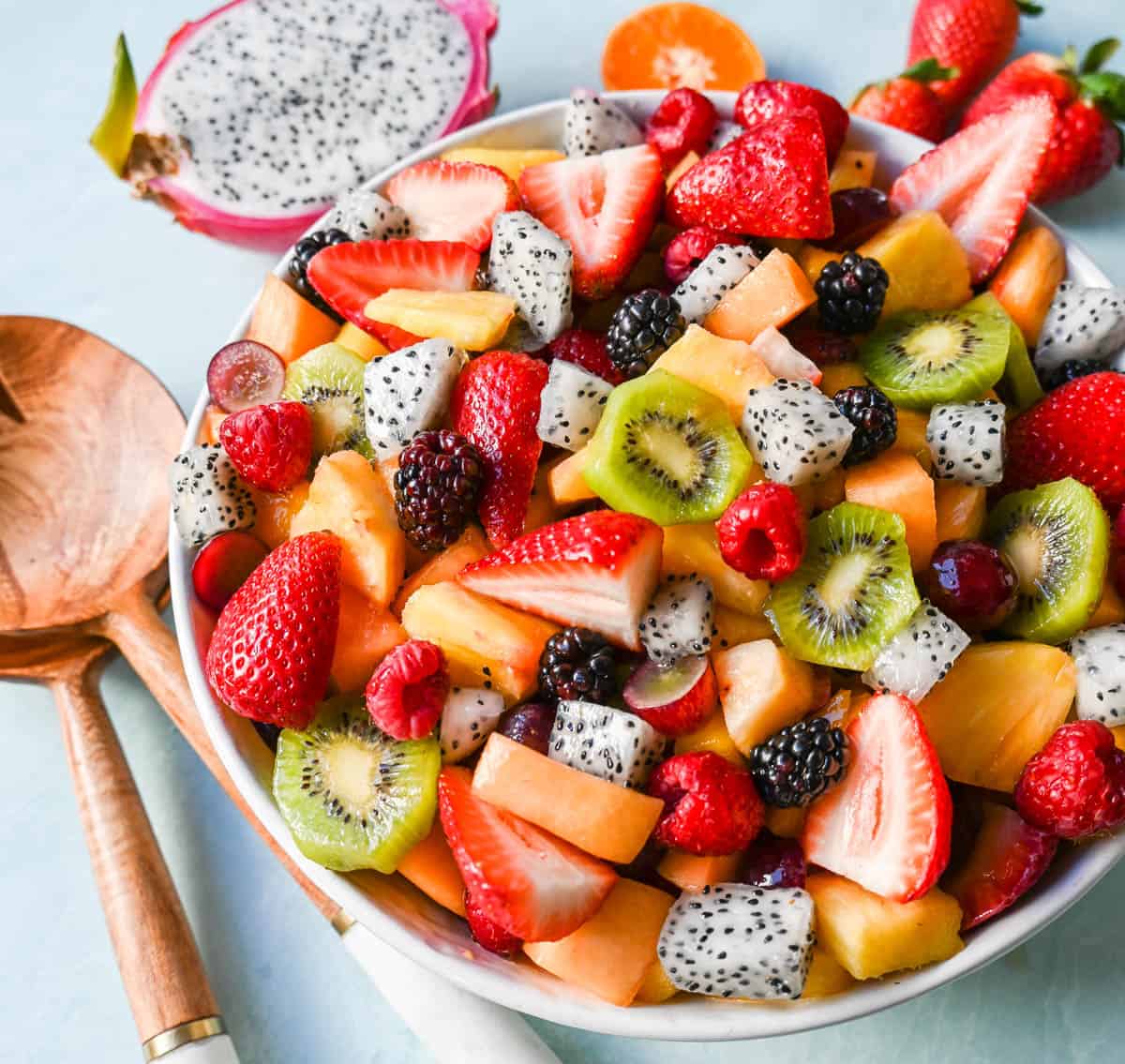 A bright and fresh fruit salad that is perfect for summertime! Made with vibrant and flavorful seasonal fruits and a sweet and simple honey lime dressing. The perfect fruit salad recipe!