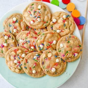 Soft, chewy sugar cookies filled with sprinkles and white chocolate. This festive funfetti cookie recipe has the perfect chewy center with buttery crisp edges filled with rainbow sprinkles.