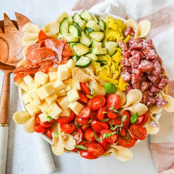 How to make the best pasta salad with Italian meats, cheese, pasta, and vegetables, all tossed with a homemade creamy red wine vinaigrette. This is such an easy, popular pasta salad recipe.