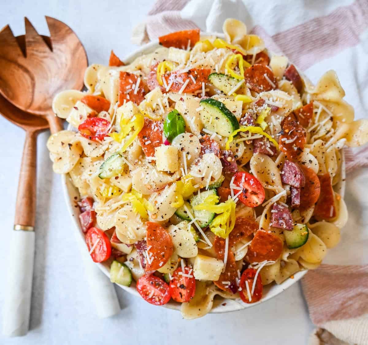 How to make the best pasta salad with Italian meats, cheese, pasta, and vegetables, all tossed with a homemade creamy red wine vinaigrette. This is such an easy, popular pasta salad recipe.