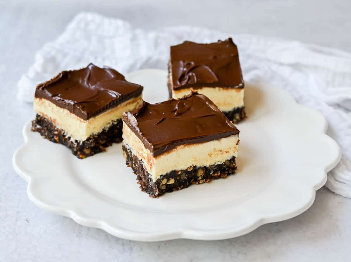 Rich and fudgy Nanaimo bars are the perfect no bake dessert. A chocolate, graham cracker, almond, and coconut base layer is topped with a creamy custard filling and chocolate ganache. You’ll be hooked on this classic Canadian treat!