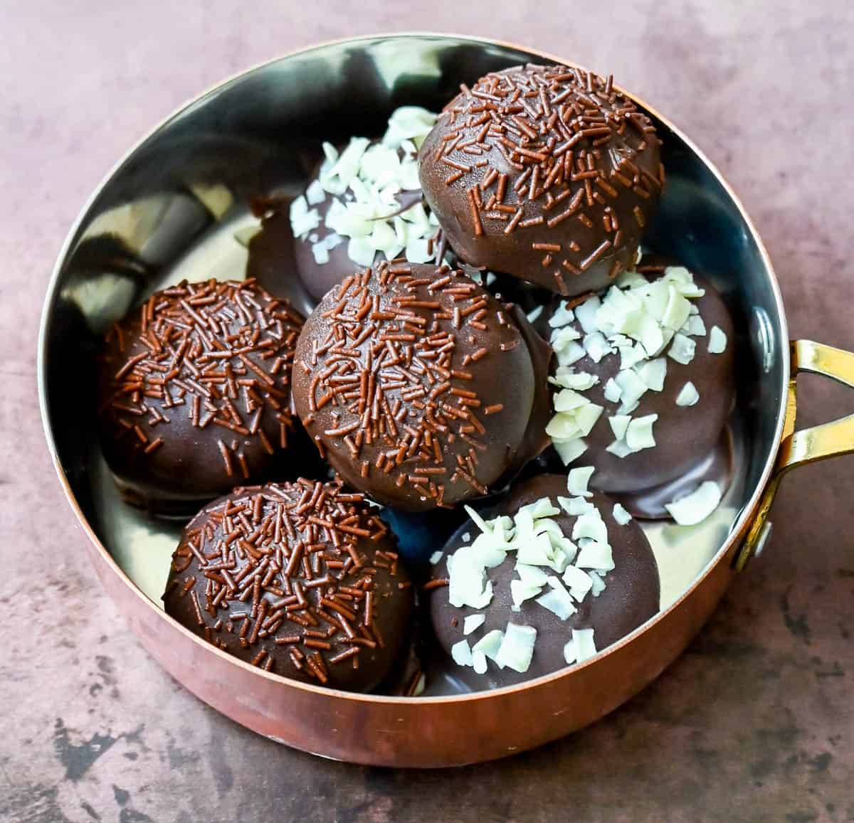 Rich and creamy Oreo cake pops with a smooth chocolate coating. An easy homemade Oreo chocolate truffle with only 4 ingredients! The BEST Oreo balls recipe.
