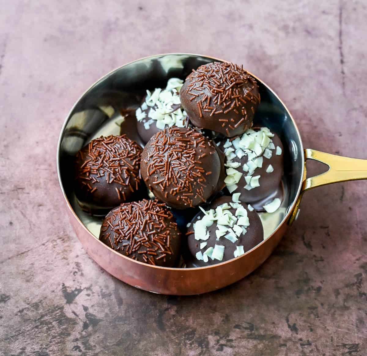 Rich and creamy Oreo cake pops with a smooth chocolate coating. An easy homemade Oreo chocolate truffle with only 4 ingredients! The BEST Oreo balls recipe.