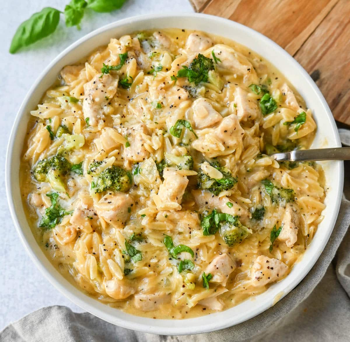 Creamy Chicken Broccoli Orzo made with sauteed chicken, fresh broccoli, orzo pasta in a cheesy sauce. This easy Cheesy Chicken Broccoli Orzo Skillet 30-minute meal is creamy and delicious!