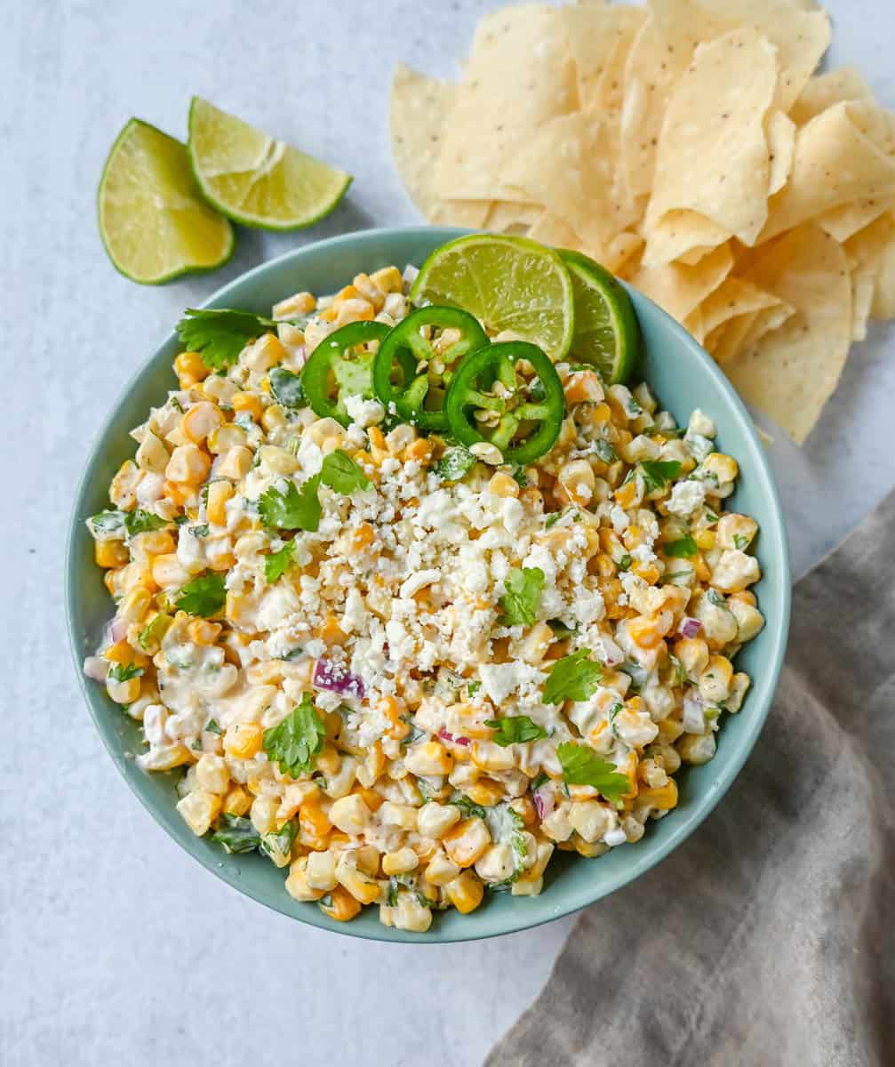 Inspired by Mexican street corn, this dip is made with sweet roasted corn and mixed with red onion, cilantro, jalapeño, lime juice, mexican spices, a touch of mayo, and cotija cheese.