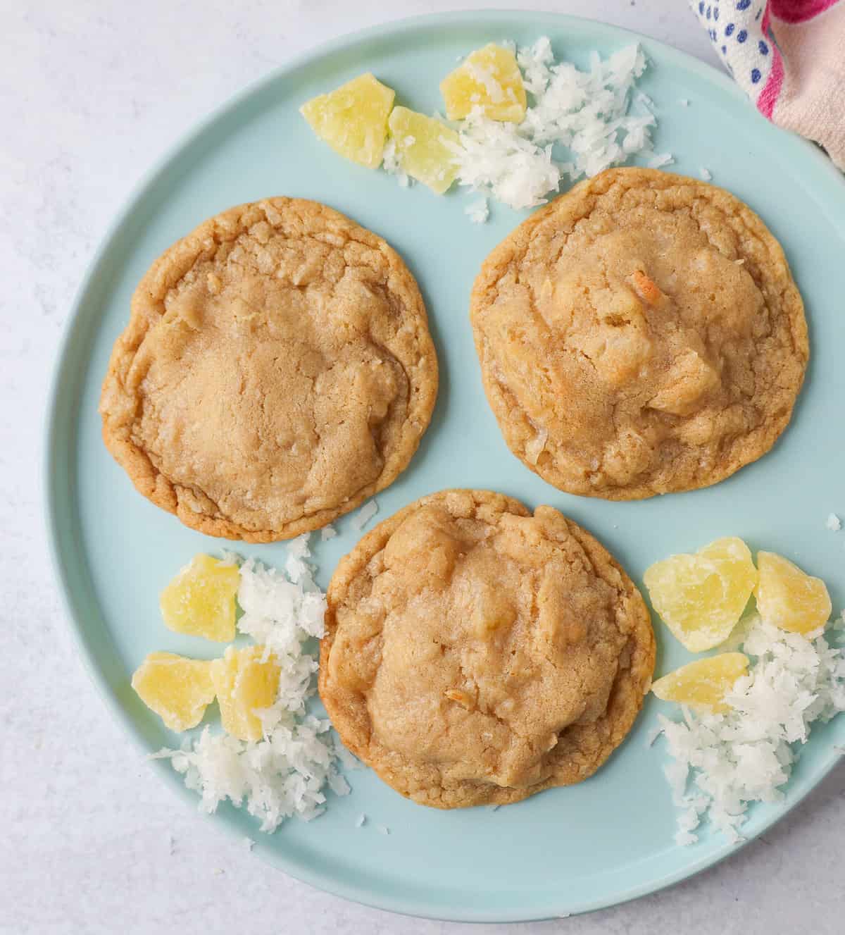 Coconut Pineapple Cookies. Soft chewy pina colada cookies with sweetened dried pineapple and sweet coconut flakes. These Hawaiian Pineapple Coconut Cookies are the perfect summer cookie.