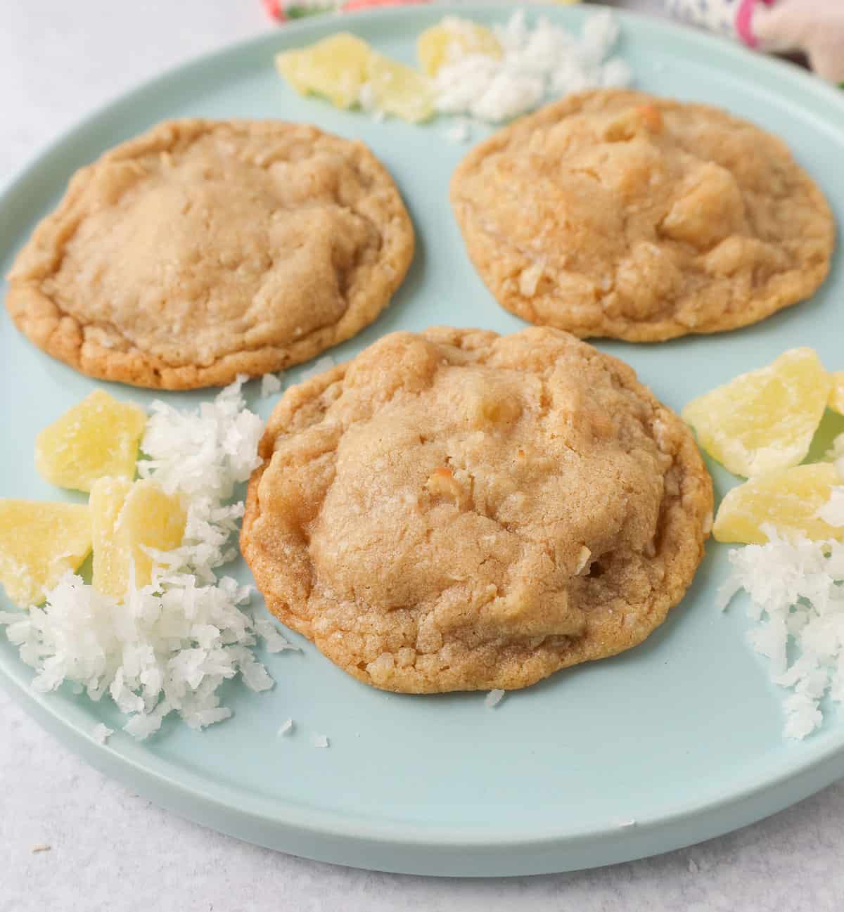 Coconut Pineapple Cookies. Soft chewy pina colada cookies with sweetened dried pineapple and sweet coconut flakes. These Hawaiian Pineapple Coconut Cookies are the perfect summer cookie.