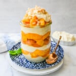 This summer dessert is made with fresh peaches in a creamy vanilla pudding and whipped cream with Nilla wafers and a buttery crumble topping. This Magnolia Bakery Peach Crisp Pudding will be your favorite no-bake summer dessert recipe. This peach trifle is like banana pudding but even better!