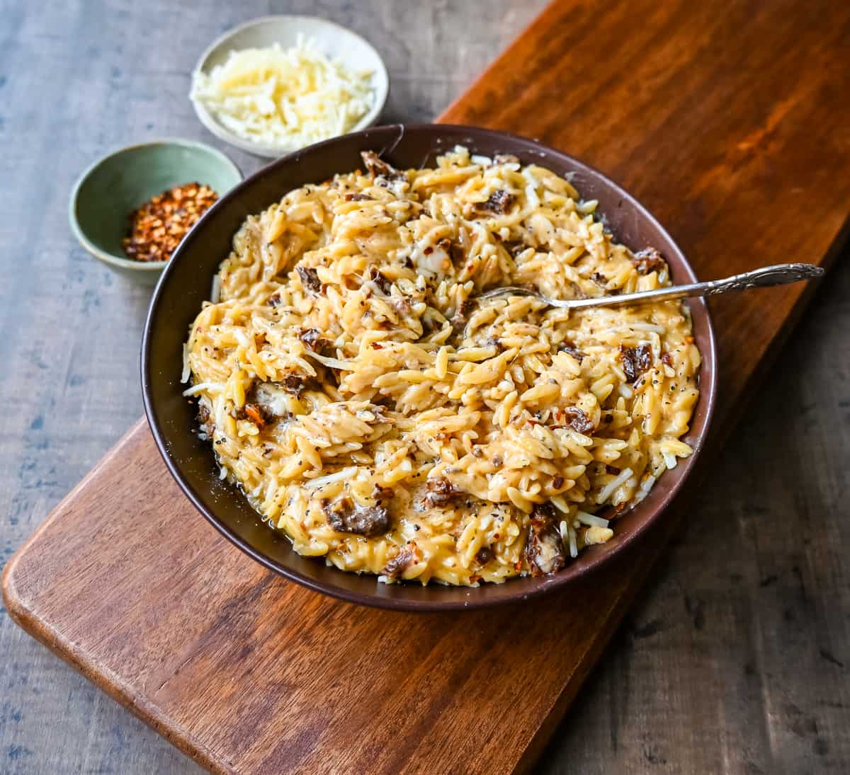 Boursin Cheese Sundried Tomato Orzo. A quick and easy one pot side dish made with orzo pasta in a creamy boursin cheese parmesan sundried tomato sauce. 