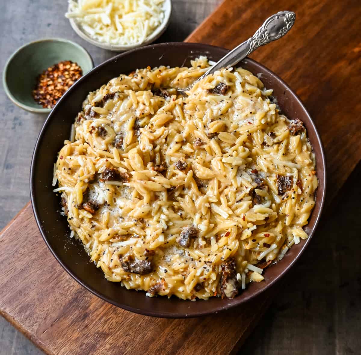 Boursin Cheese Sundried Tomato Orzo. A quick and easy one pot side dish made with orzo pasta in a creamy boursin cheese parmesan sundried tomato sauce.