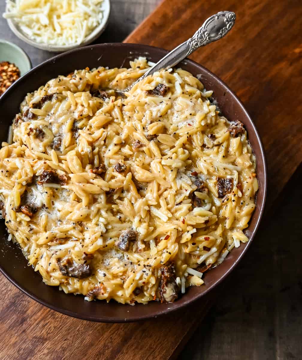 Boursin Cheese Sundried Tomato Orzo. A quick and easy one pot side dish made with orzo pasta in a creamy boursin cheese parmesan sundried tomato sauce. 