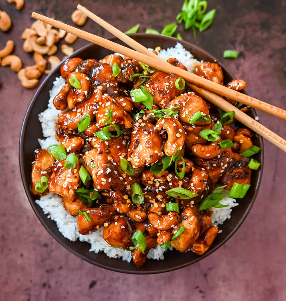 How to make Better than Take Out Cashew Chicken at home. This quick and easy cashew chicken is made with chicken, crunchy cashews, in a velvety homemade stir fry sauce.