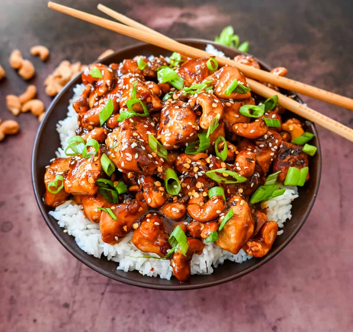 How to make Better than Take Out Cashew Chicken at home. This quick and easy cashew chicken is made with chicken, crunchy cashews, in a velvety homemade stir fry sauce.