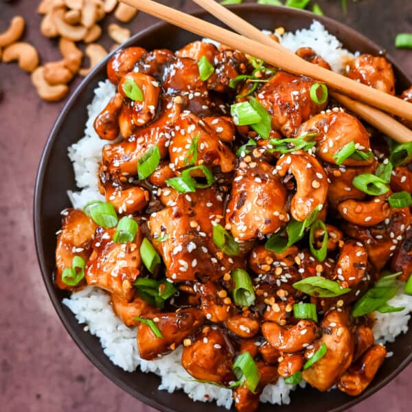 How to make Better than Take Out Cashew Chicken at home. This quick and easy cashew chicken is made with chicken, crunchy cashews, in a velvety homemade stir fry sauce.
