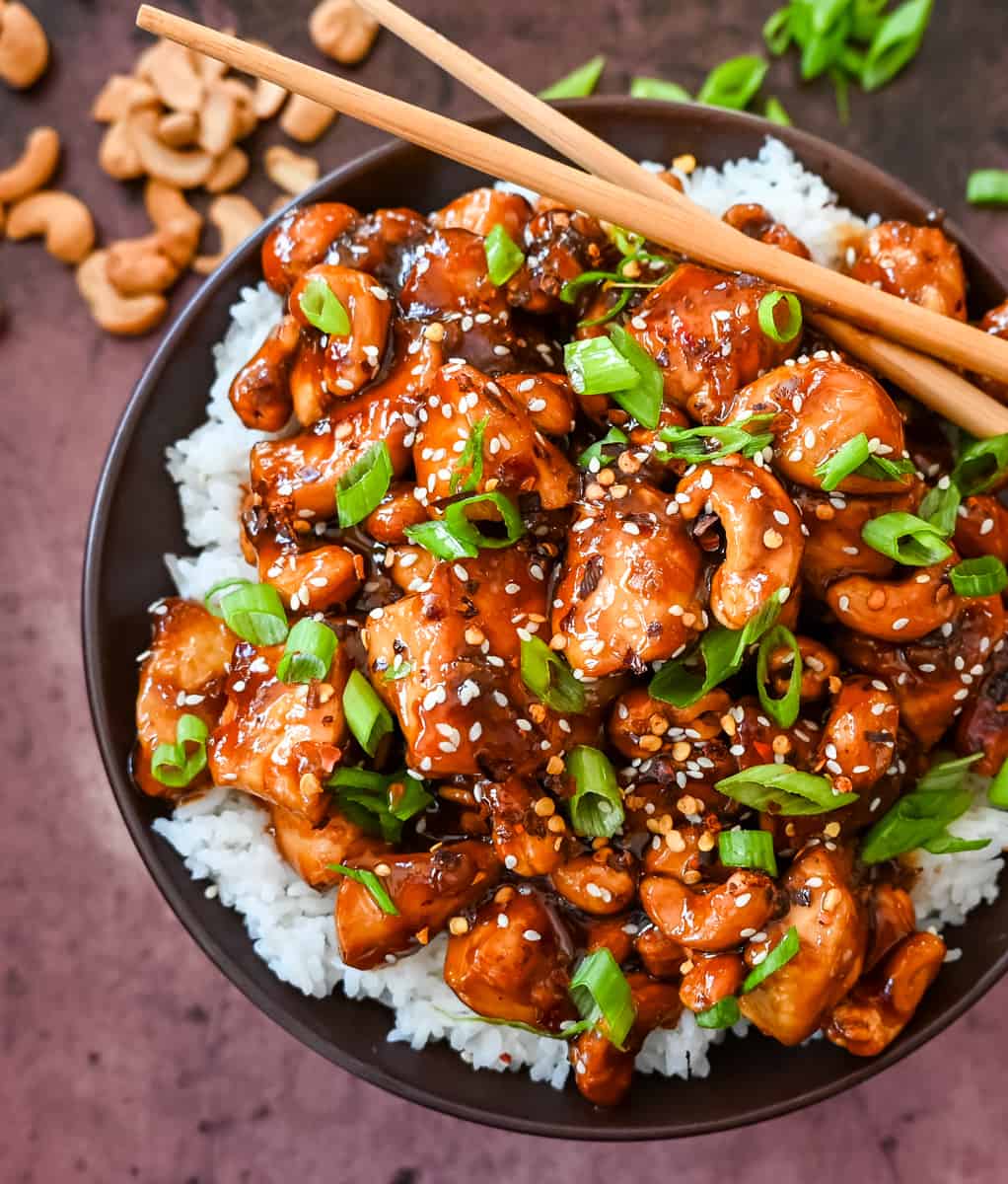How to make Better than Take Out Cashew Chicken at home. This quick and easy cashew chicken is made with chicken, crunchy cashews, in a velvety homemade stir fry sauce.