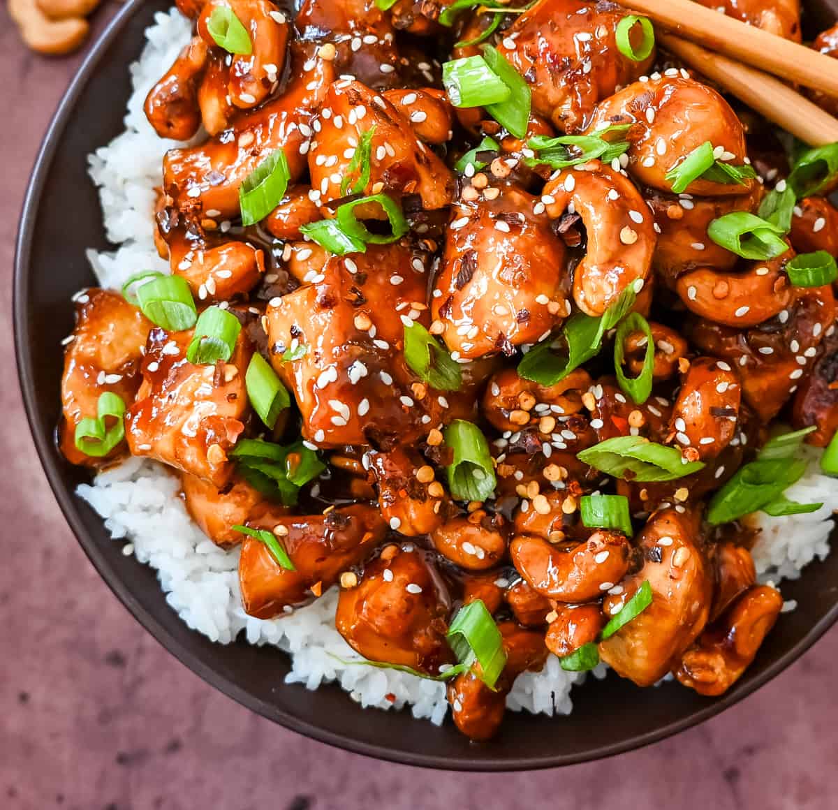 How to make Better than Take Out Cashew Chicken at home. This quick and easy cashew chicken is made with chicken, crunchy cashews, in a velvety homemade stir fry sauce.