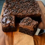How to make the best chocolate zucchini cake with chocolate frosting. This frosted chocolate zucchini cake is the most moist, rich chocolate cake with the most decadent chocolate frosting. You will not even realize you are eating zucchini!