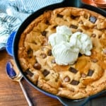 This salted caramel chocolate skillet cookie baked in a cast iron skillet and topped with vanilla ice cream has the perfect combination of sweet and salty caramel, and decadent chocolate in a perfectly buttery cookie.