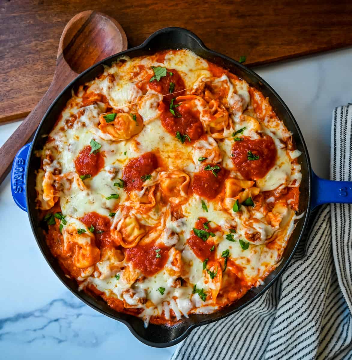 Cheese Tortellini with Sausage Ragu. This quick and easy 20 minute pasta bake is made with cheese tortellini in an Italian sausage ragu sauce and topped with cheesy melted mozzarella cheese. Everyone loves this easy pasta dinner made with only 5 ingredients!