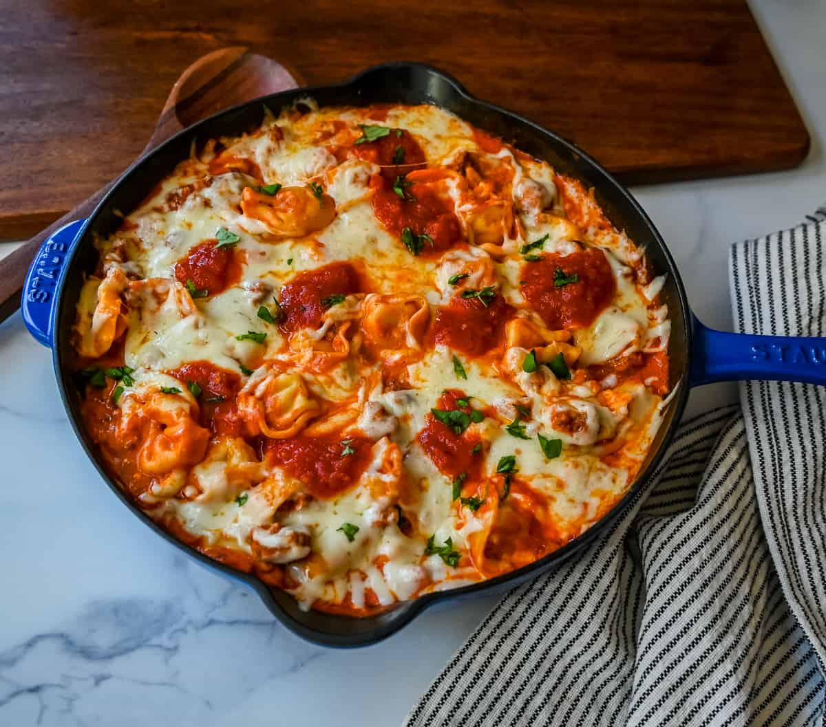 Cheese Tortellini with Sausage Ragu. This quick and easy 20 minute pasta bake is made with cheese tortellini in an Italian sausage ragu sauce and topped with cheesy melted mozzarella cheese. Everyone loves this easy pasta dinner made with only 5 ingredients!