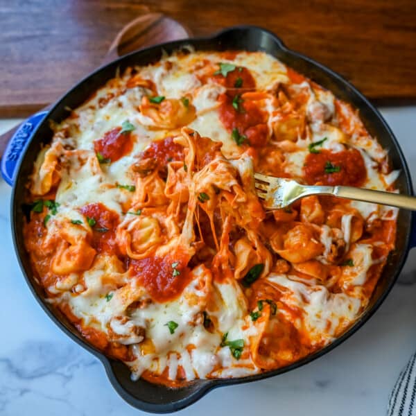 Cheese Tortellini with Sausage Ragu. This quick and easy 20 minute pasta bake is made with cheese tortellini in an Italian sausage ragu sauce and topped with cheesy melted mozzarella cheese. Everyone loves this easy pasta dinner made with only 5 ingredients!