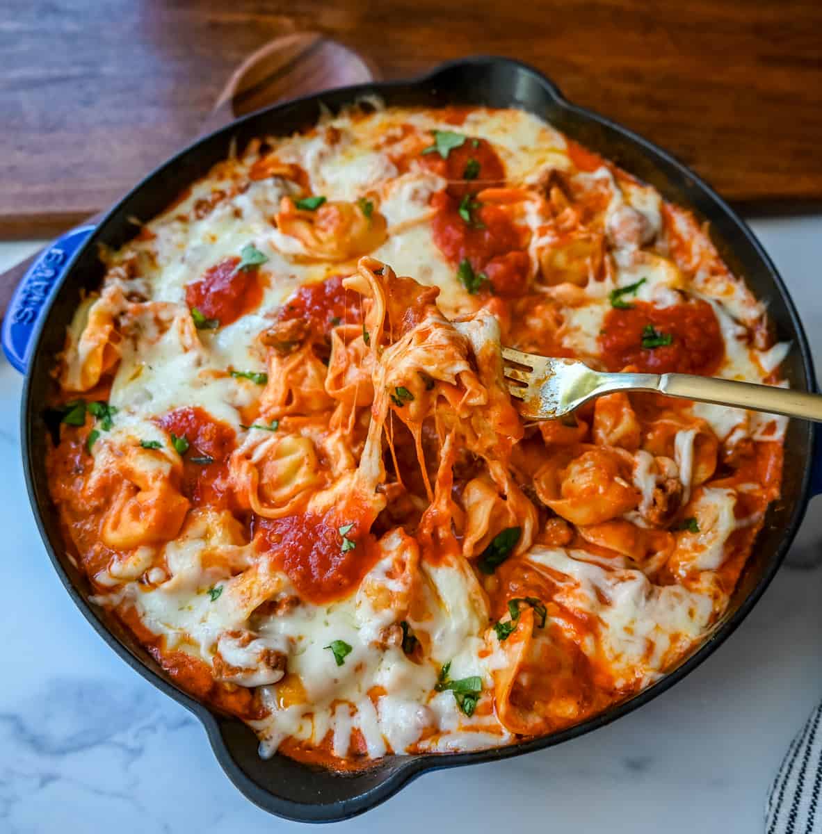 Cheese Tortellini with Sausage Ragu. This quick and easy 20 minute pasta bake is made with cheese tortellini in an Italian sausage ragu sauce and topped with cheesy melted mozzarella cheese. Everyone loves this easy pasta dinner made with only 5 ingredients!